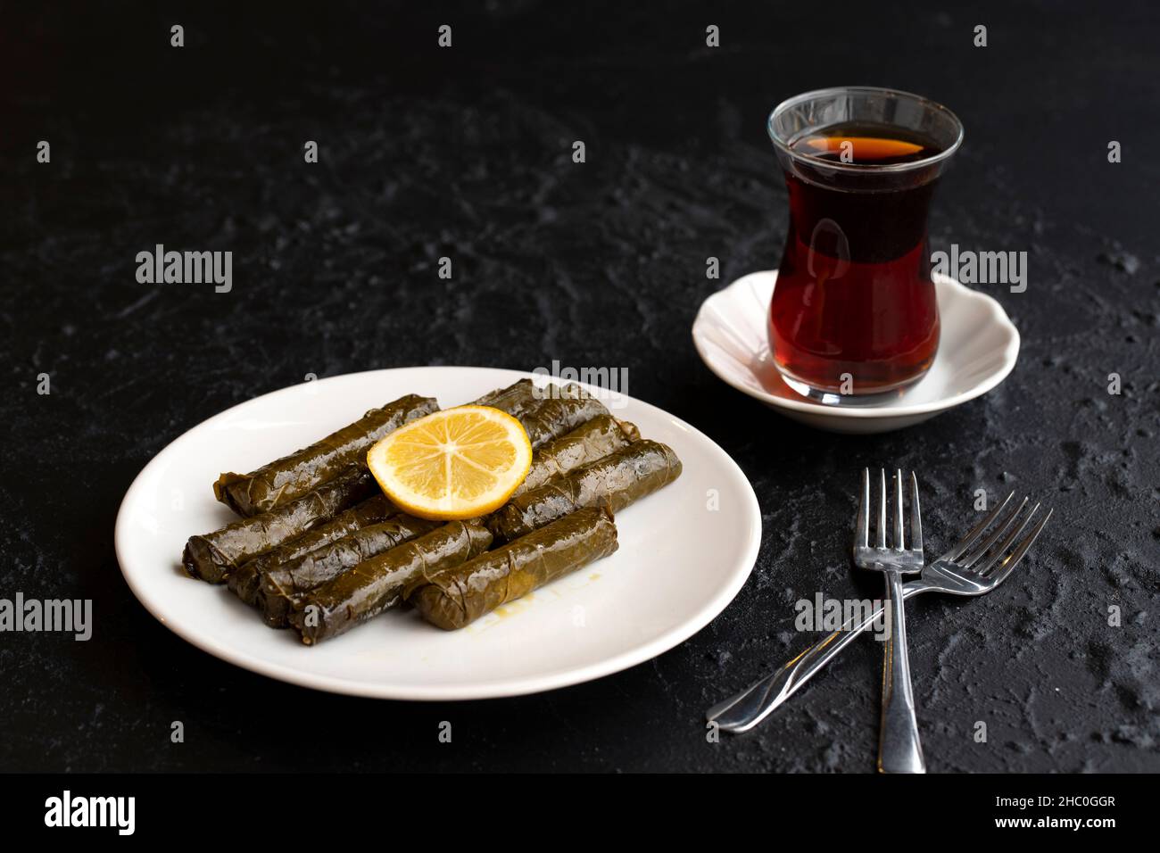Delicious dolma (sarma) stuffed grape leaves rice, white yogurt sauce