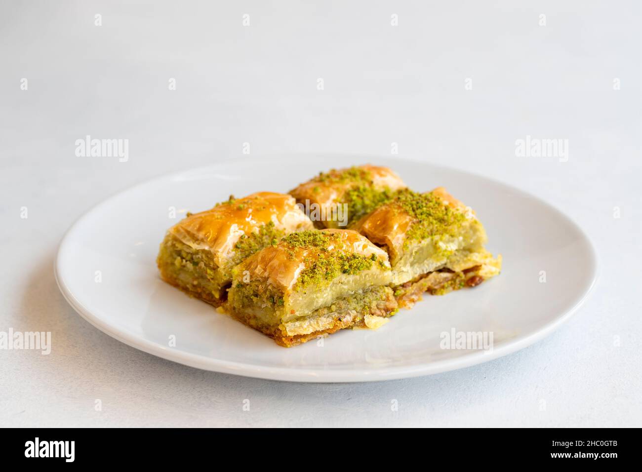 Pistachio baklava dessert on a white background. Turkish sweet dessert