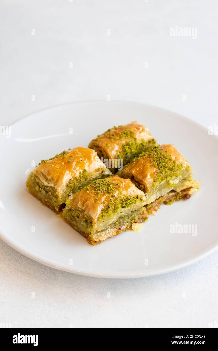 Pistachio baklava dessert on a white background. Turkish sweet dessert