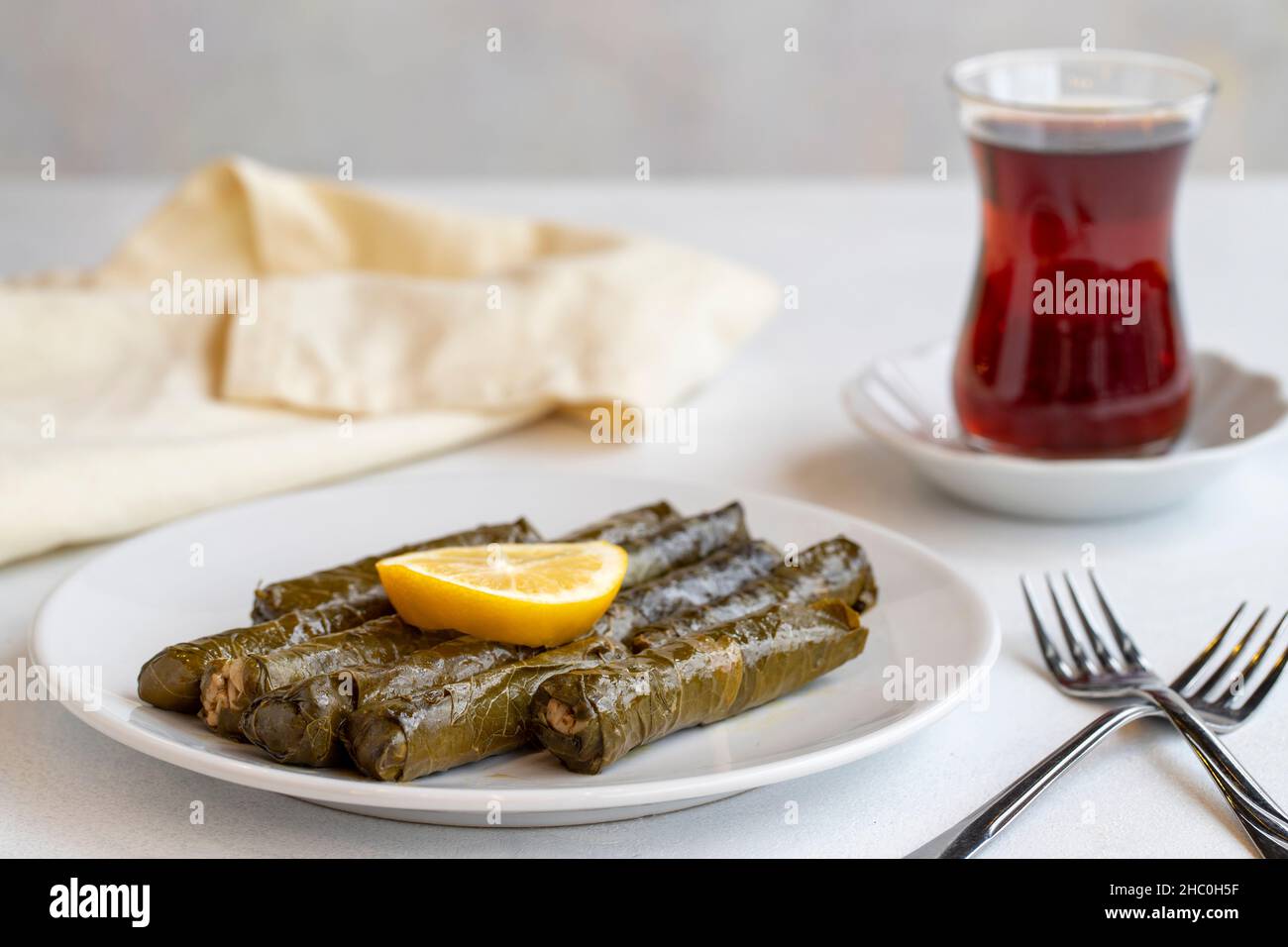 Delicious dolma (sarma) stuffed grape leaves rice, white yogurt sauce