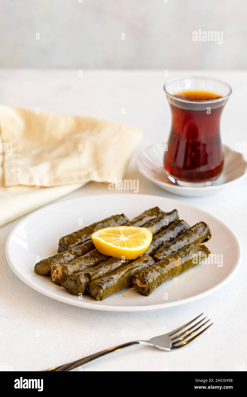 Delicious dolma (sarma) stuffed grape leaves rice, white yogurt sauce