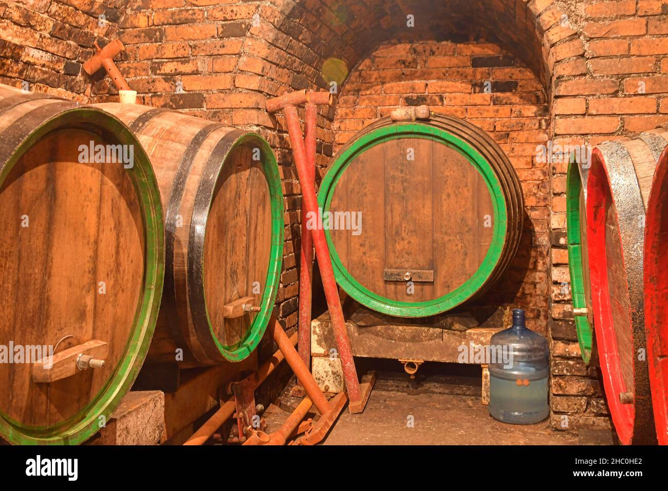 Old cellar with wooden barrels. Traditional making wine. Wine cellar
