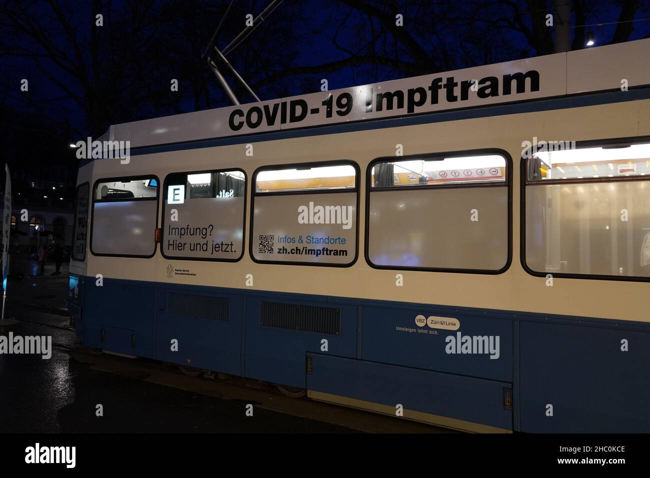 Vaccination tram in downtown of Zurich during evening hours. Stock Photo
