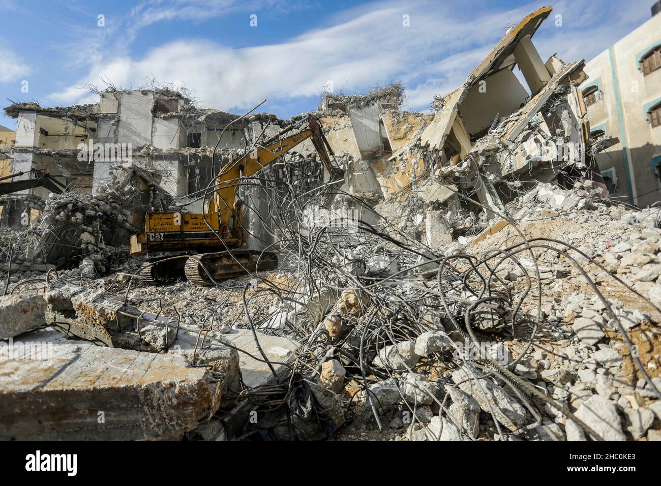 Gaza, Palestine. 22nd Dec, 2021. A bulldozer removes debris of Al ...
