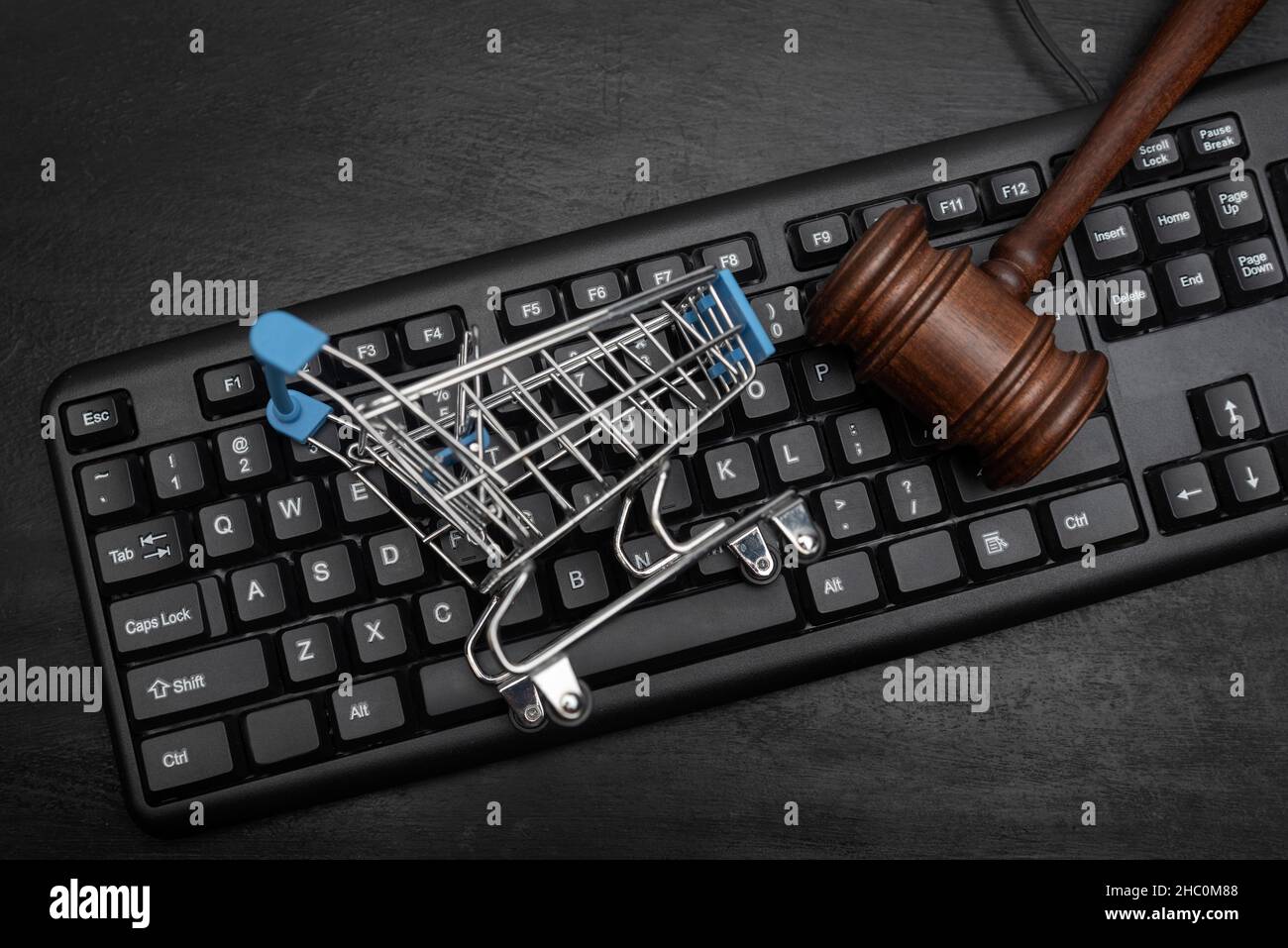 Keyboard, shopping cart and judges hammer. Online Auction Stock Photo