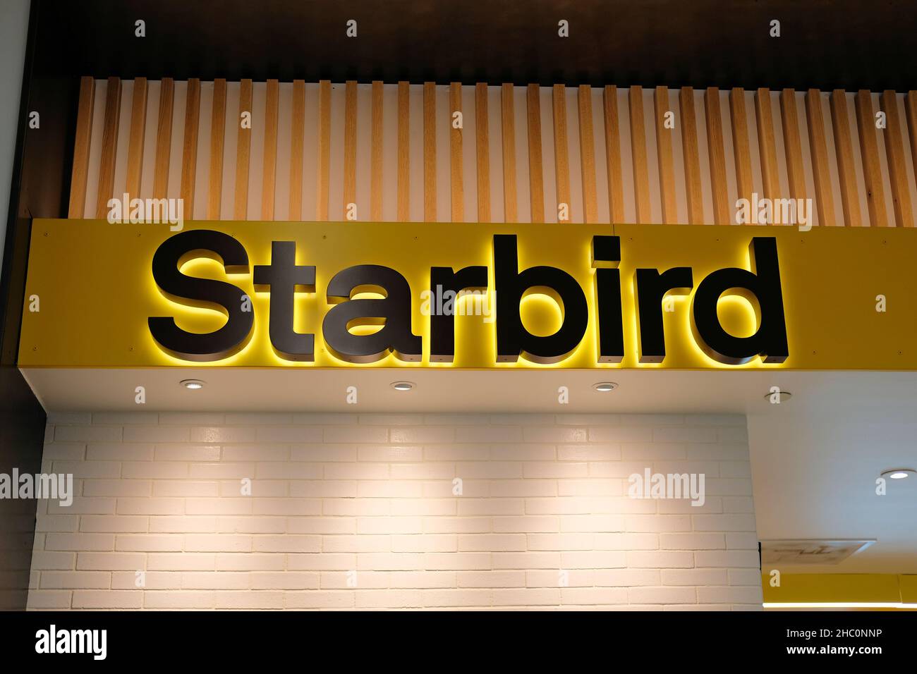 Starbird Chicken restaurant logo at San Francisco International Airport in California; a Bay Area premium fast food eatery; chicken fast food dining. Stock Photo