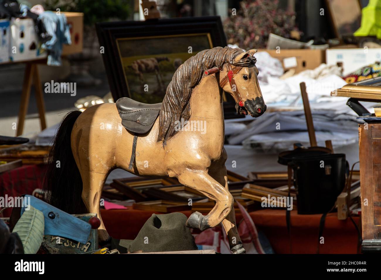 An ancient rocking horse is on sale at the antiques fair in Pescia