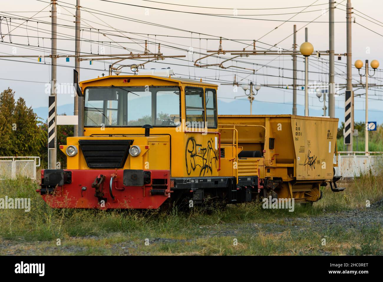 Locomotive wagons for railway line maintenance parked on a siding Stock Photo