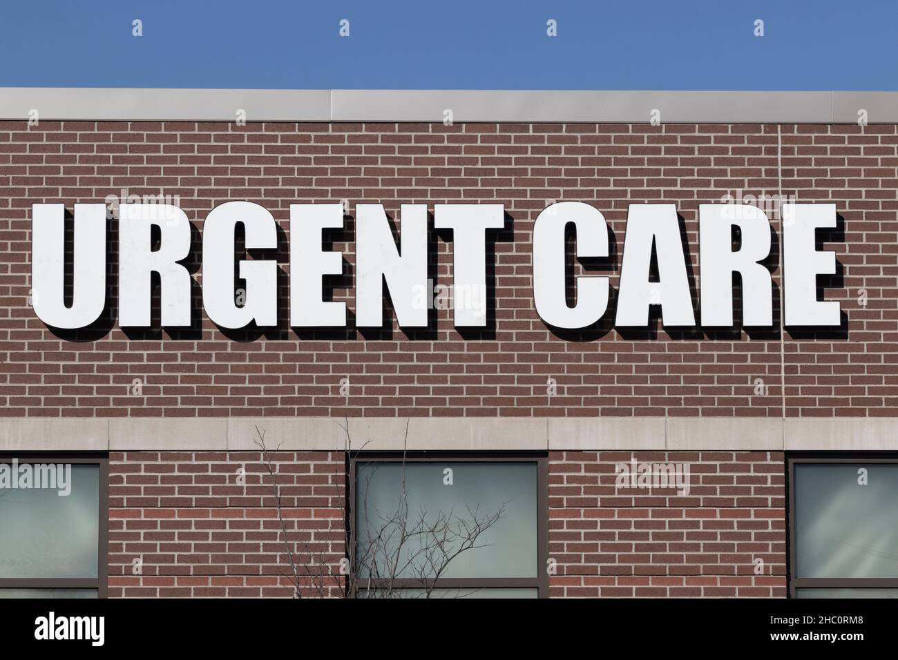 URGENT CARE sign at an outpatient health clinic. Urgent Care clinics may offer quicker service than an ER. Stock Photo