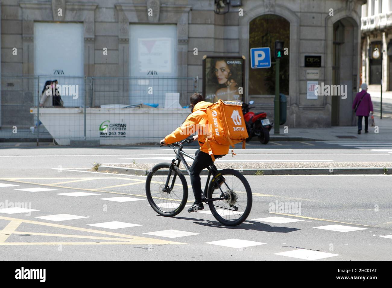 Just Eat Worker Rider Bikes Riding on his bike Delivering Food in A Coruna on May 1, 2021 Stock Photo
