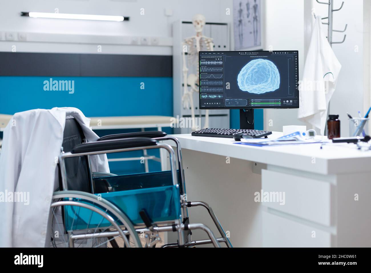 Modern empty hospital office having computer with brain radiography on ...