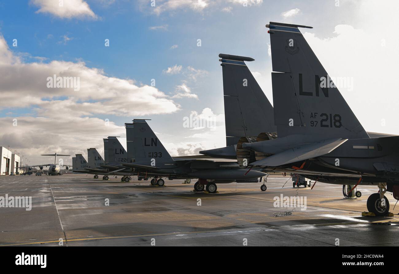 U.S. Air Force F-15C Eagles and F-15E Strike Eagles from Royal Air Force Lakenheath, England, stop at Ramstein Air Base, Germany, for a routine training opportunity, Dec. 7, 2021. Members from the 748th Aircraft Maintenance Squadron, 48th Aircraft Maintenance Squadron and 435th Contingency Response Squadron gathered to share platform knowledge.  Joint and combined training across various aircraft platforms increases lethality and coalition interoperability. (U.S. Air Force photo by Senior Airman Andrew J. Alvarado) Stock Photo