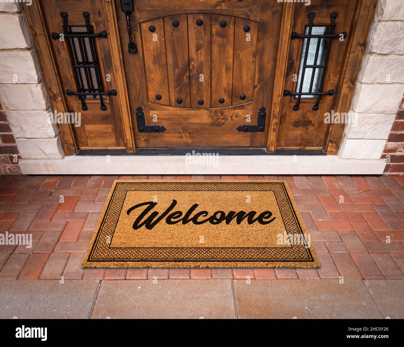 Welcome Mat At Custom Front Door Of House. Stock Photo