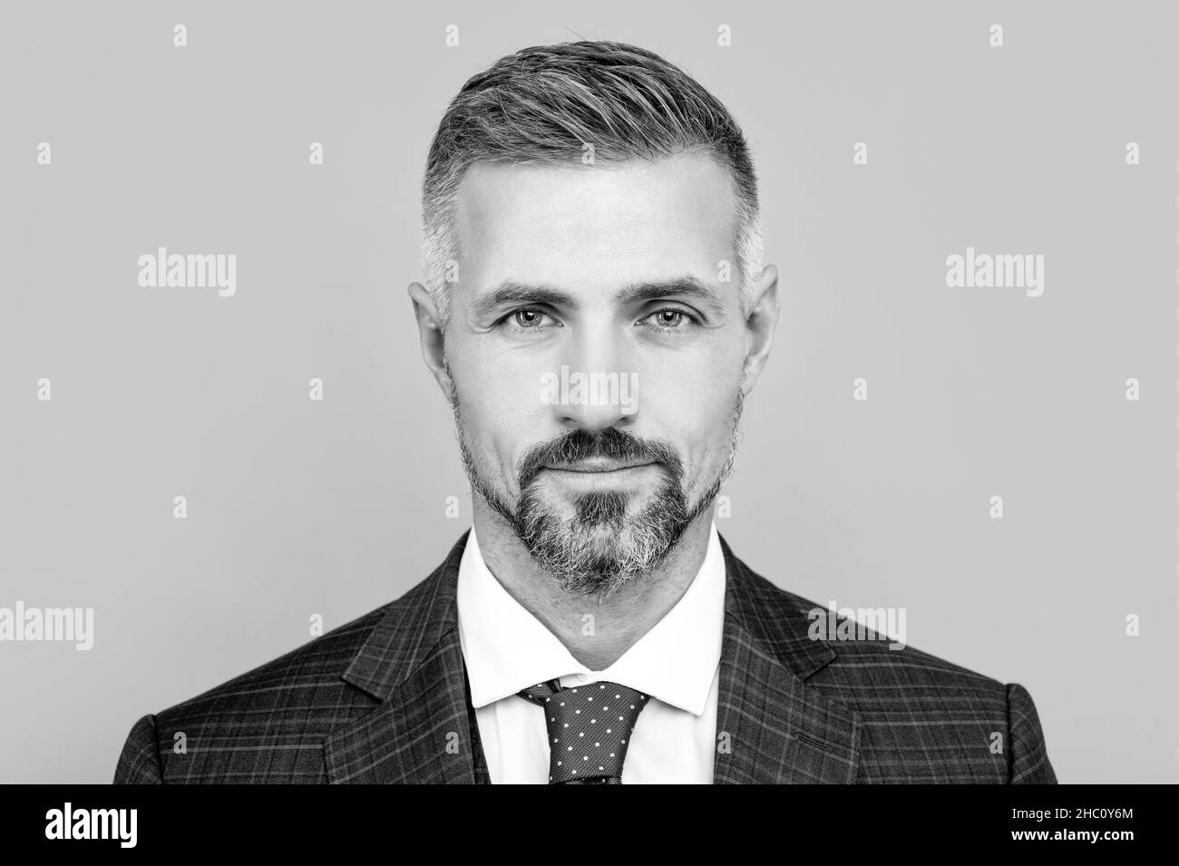 Mature confident businessman in suit Black and White Stock Photos