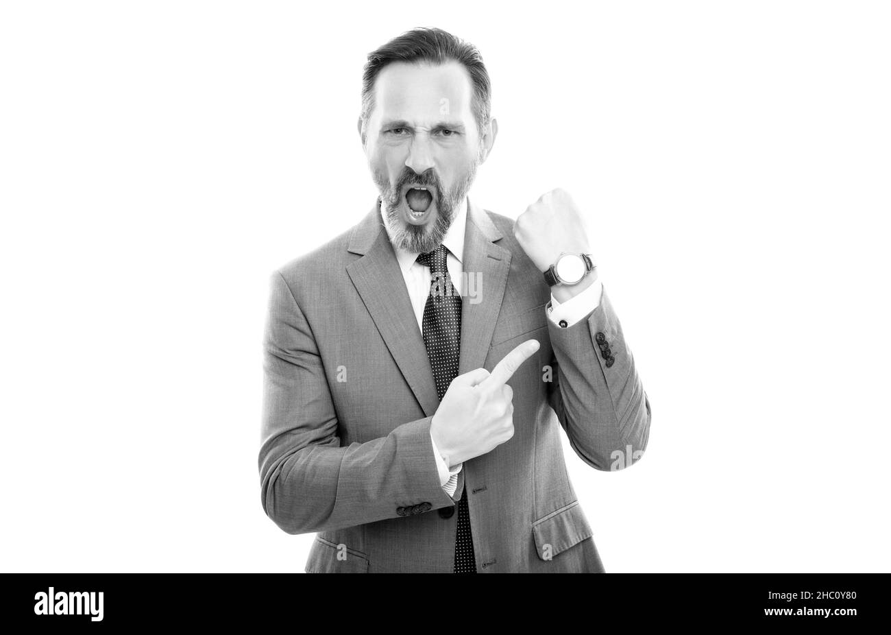 angry mature director in suit pointing finger on time on watch isolated on white, late. Stock Photo