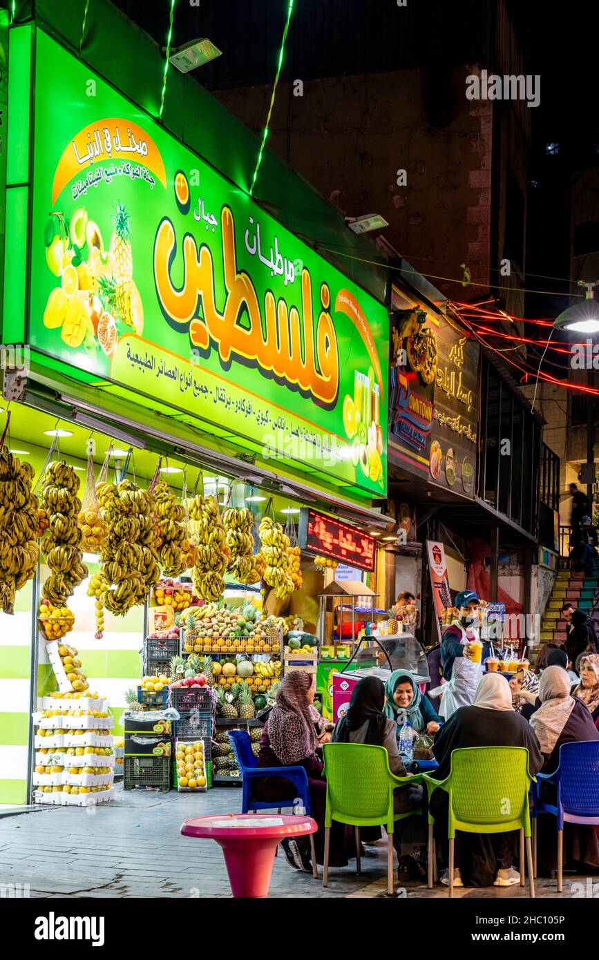 A Group Of Jordanian Women Sitting Outside A Downtown Juice Bar