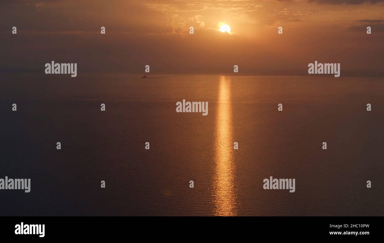 Aerial view of a golden sunset sky background with evening clouds over ...