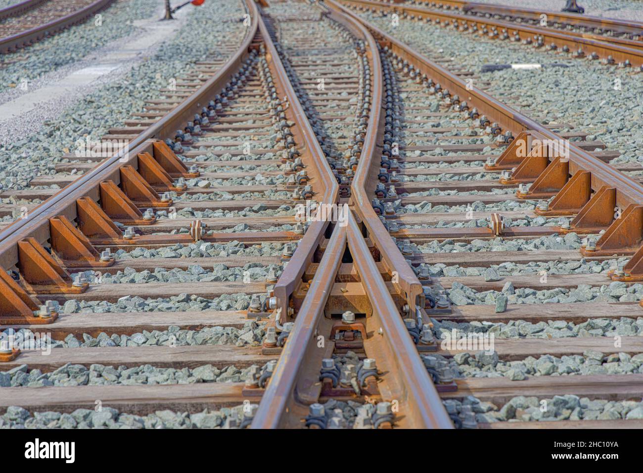Train railroad tracks intersection close up Stock Photo