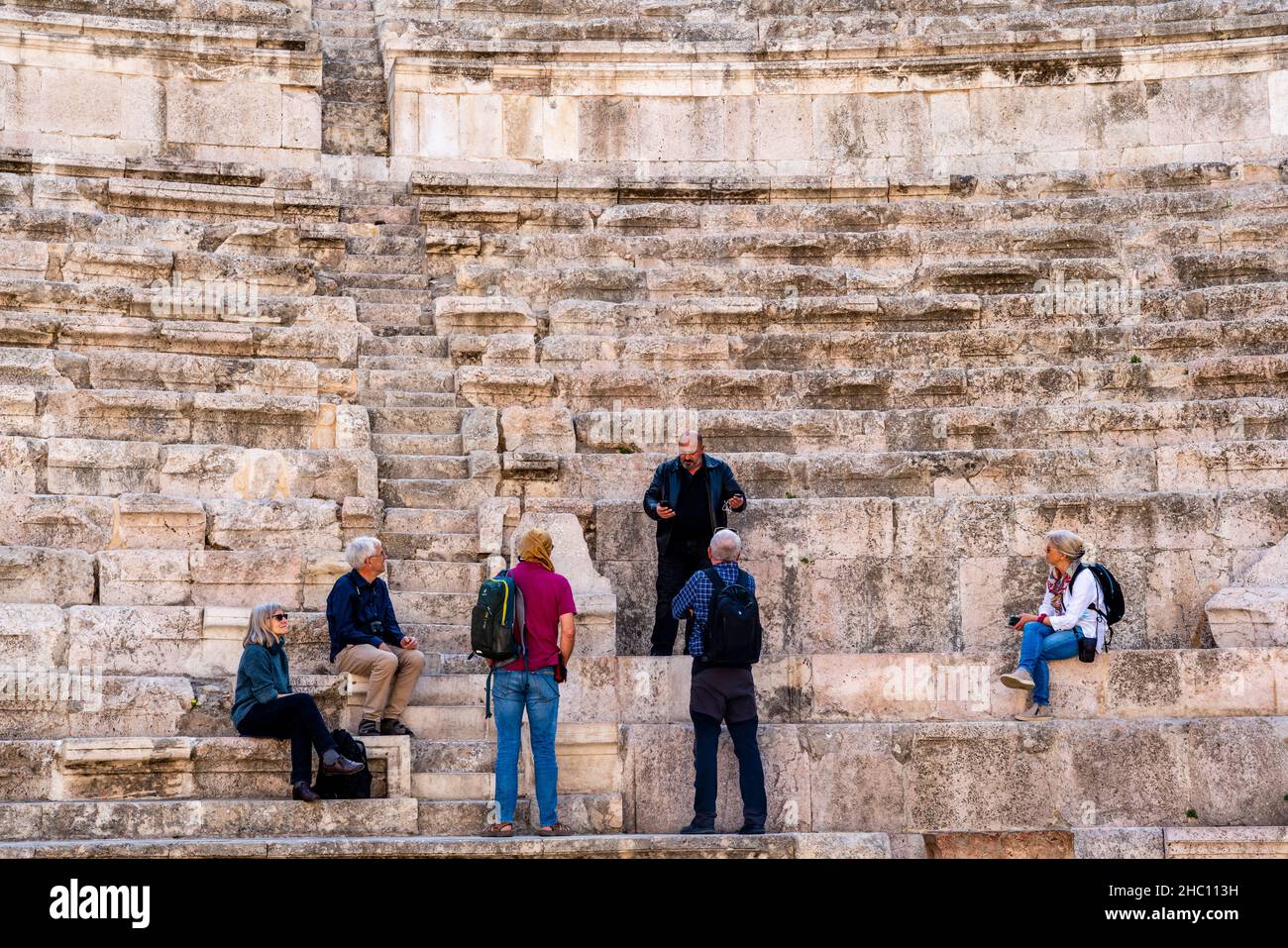 A Tour Group and Guide At The Roman Theatre, Amman, Jordan. Stock Photo