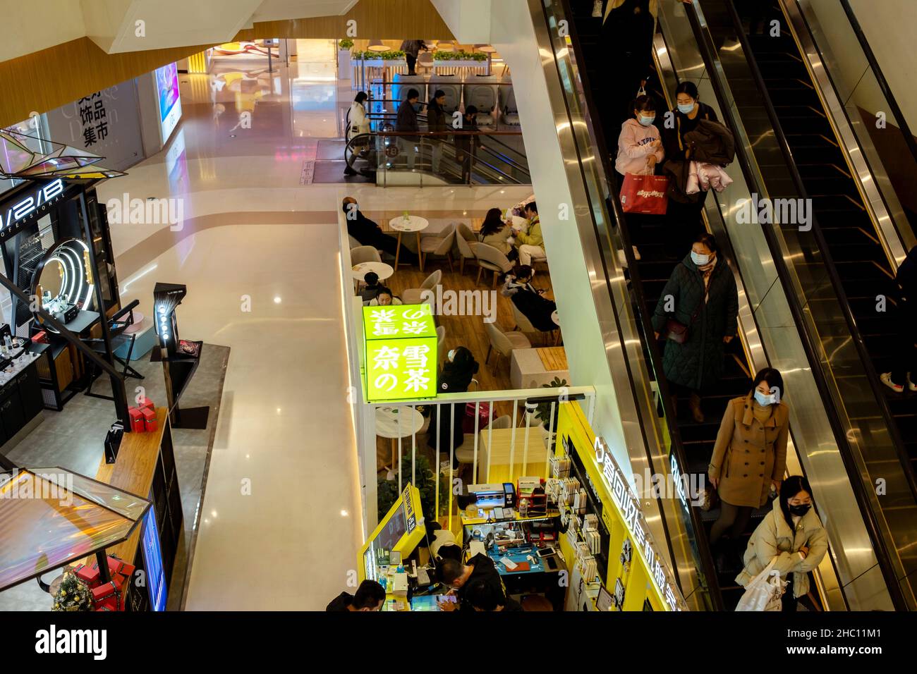People wearing masks in shopping mall Stock Photo Alamy