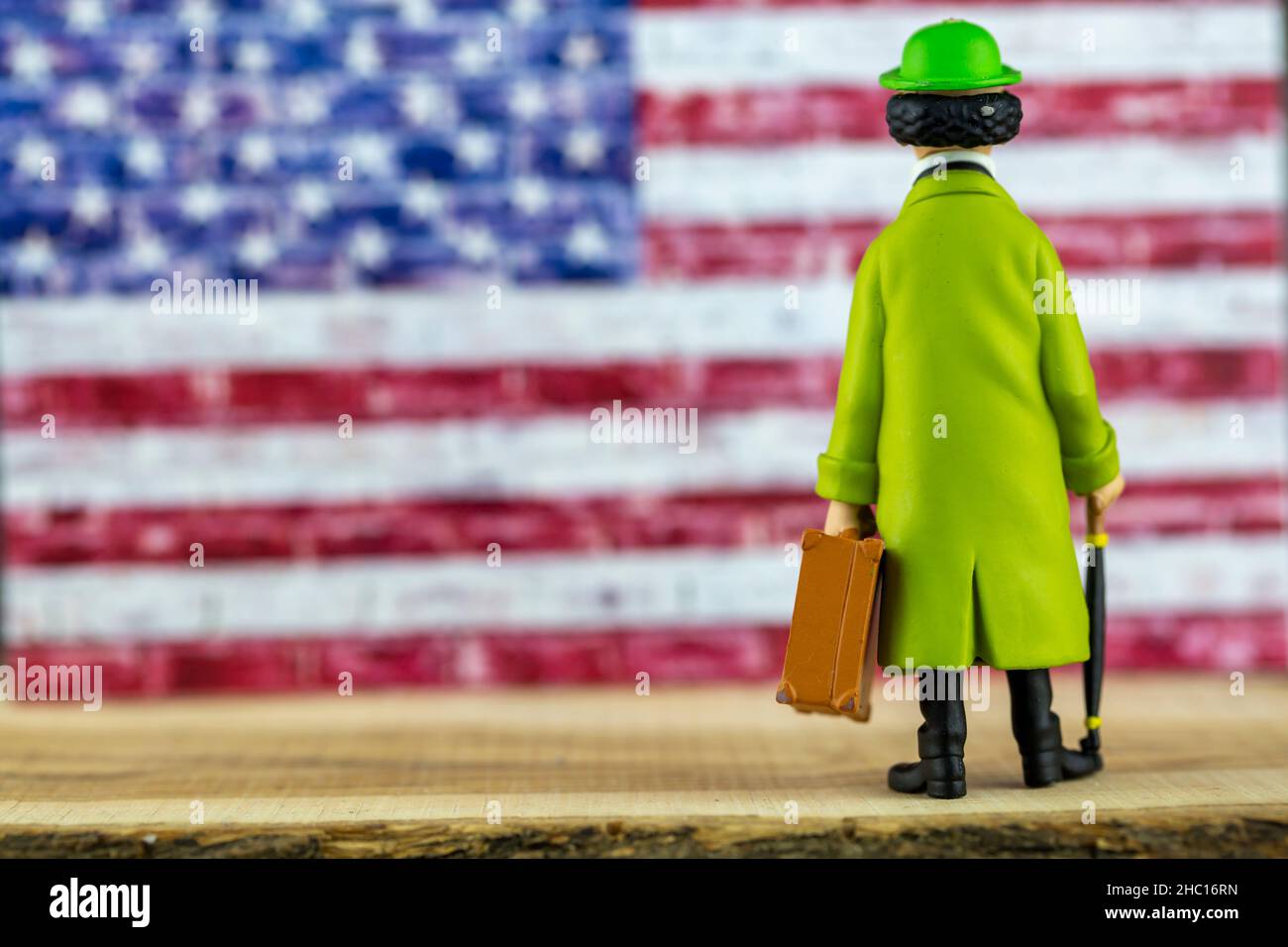Green Card or Tourist Concept, Man and American Flag Stock Photo