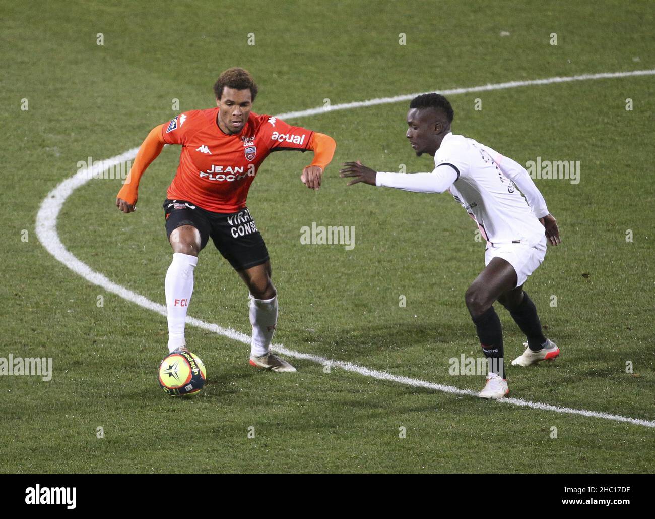 Armand Lauriente of Lorient, Idrissa Gueye Gana of PSG during the French championship Ligue 1 football match between Fc Lorient (FCL) and Paris Saint-Germain (PSG) on December 22, 2021 at Stade du Moustoir in Lorient, France - Photo: Jean Catuffe/DPPI/LiveMedia Stock Photo