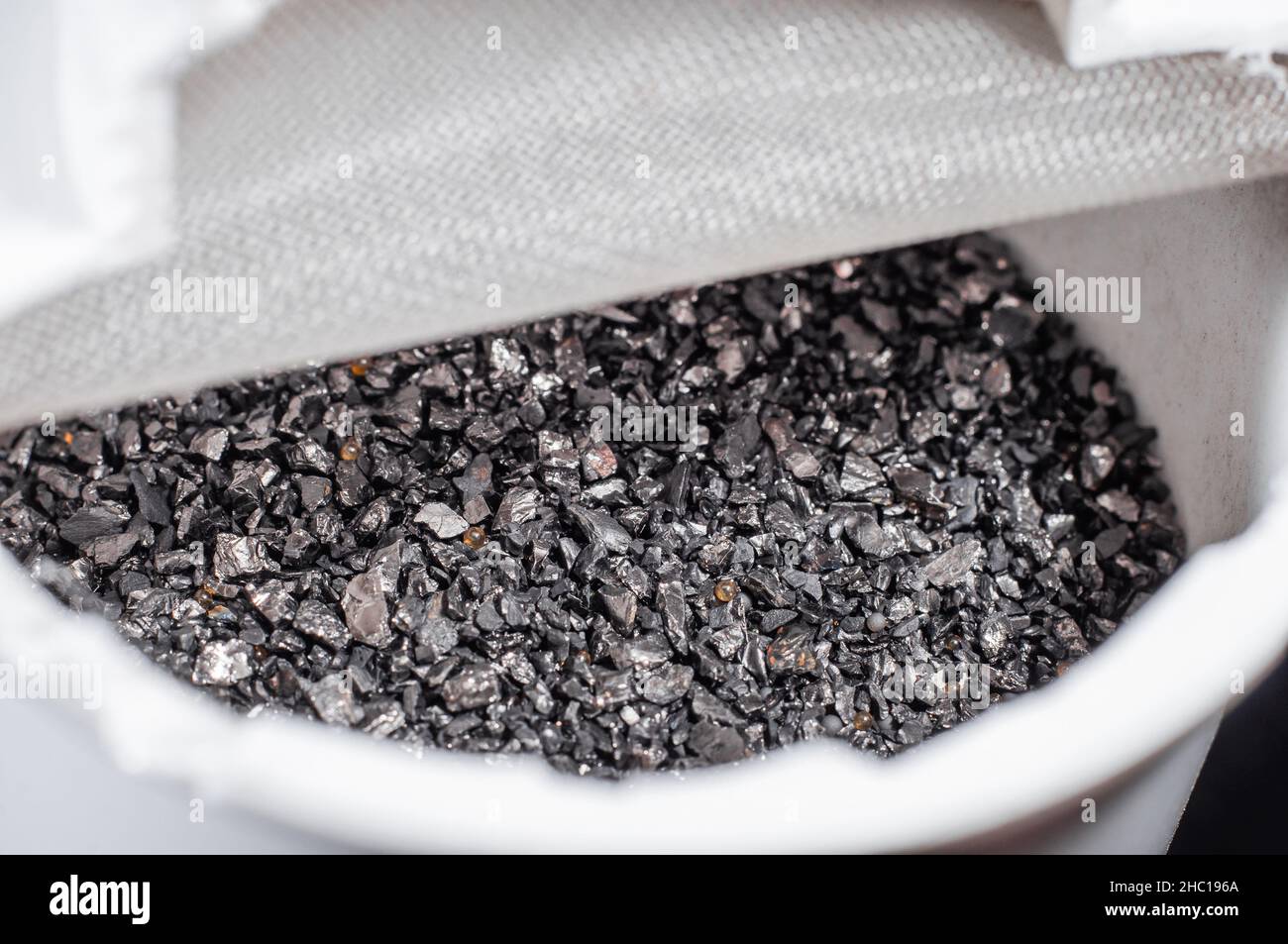 Cutaway of a kitchen filter cartridge with activated carbon and ion exchange resins Stock Photo