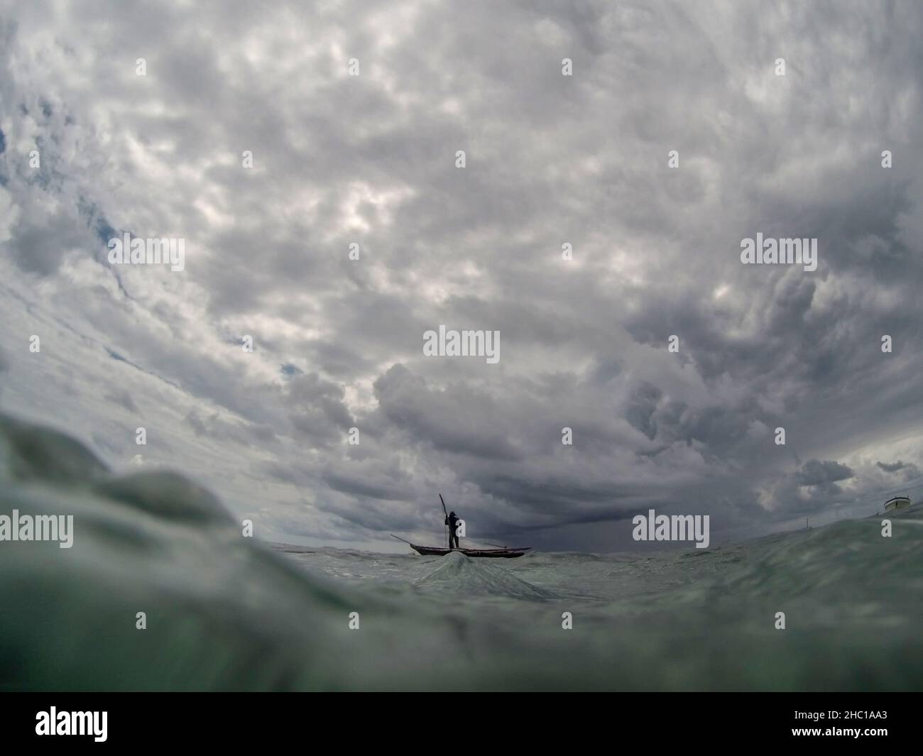 Indian man in small boat hi-res stock photography and images - Alamy