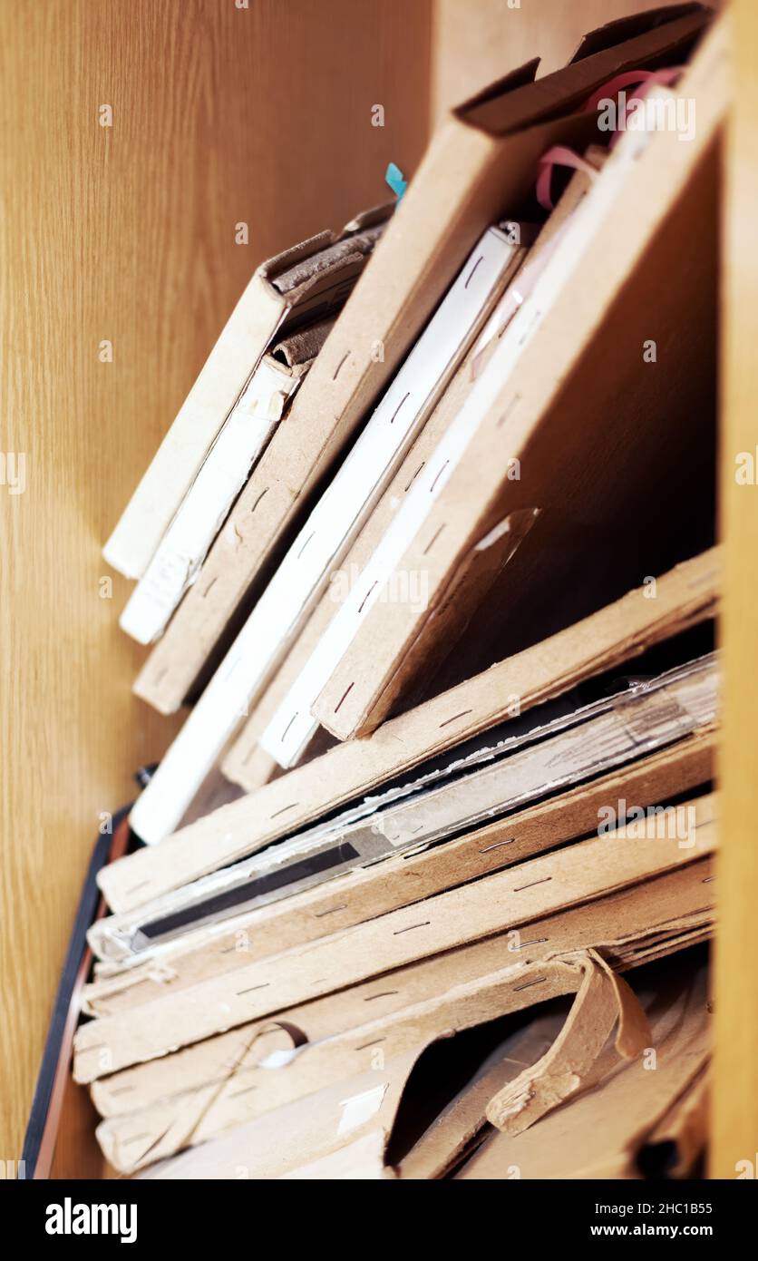 Paper box with old tapes . Archival vintage records Stock