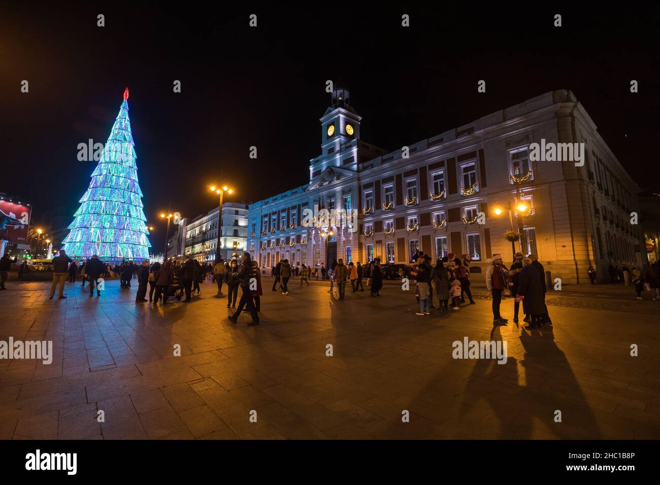 Madrid, Spain - December 13, 2021: Christmas lights shine on La Puerta del Sol square in Madrid, Spain. Stock Photo