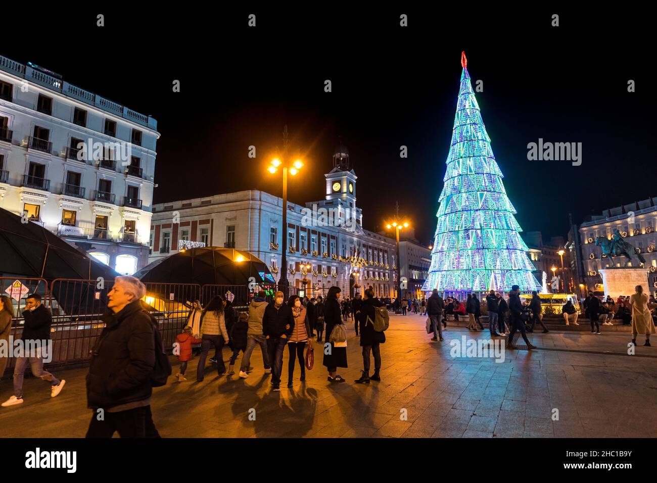 Madrid, Spain - December 13, 2021: Christmas lights shine on La Puerta del Sol square in Madrid, Spain. Stock Photo