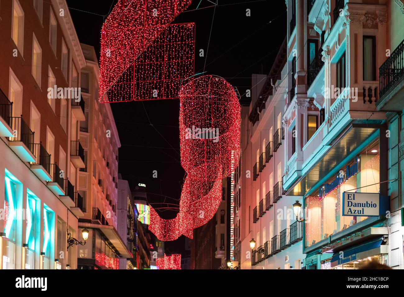 Madrid, Spain - December 13, 2021: Christmas lights shine on Preciados street n Madrid, Spain. Stock Photo