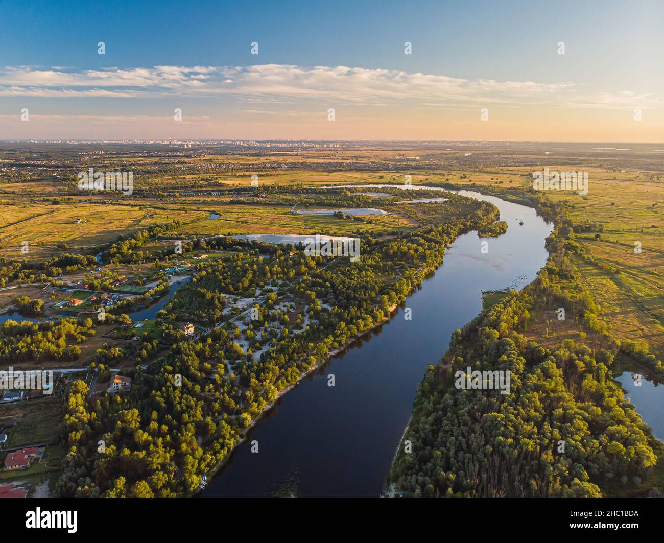River bend surrounded by fields from bird's eye view Stock Photo Alamy