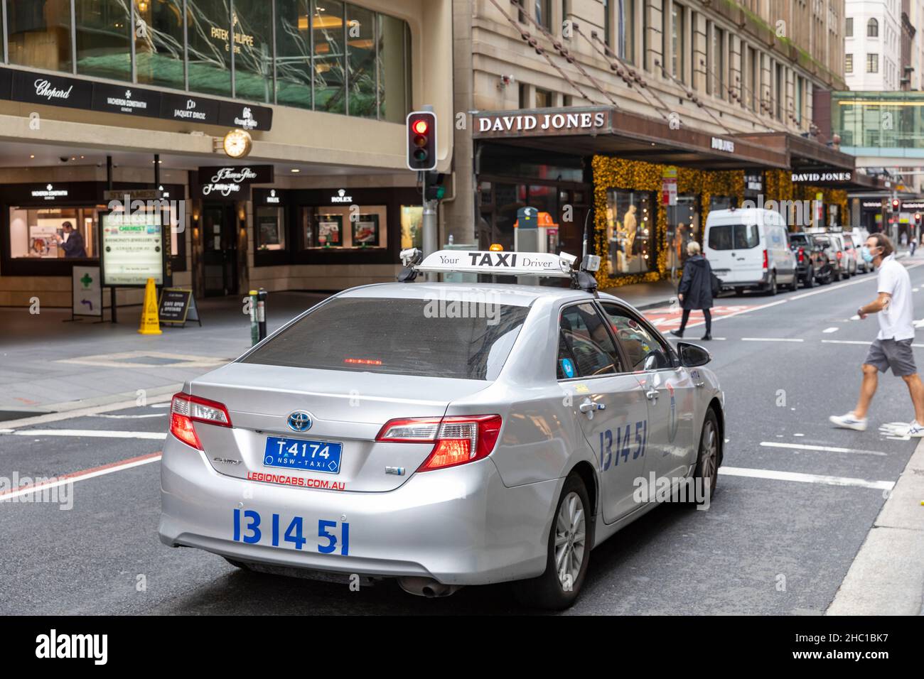 Sydney taxi, a toyota car, on Castlereagh street in Sydney city centre heading towards David Jones department store,Sydney,Australia Stock Photo