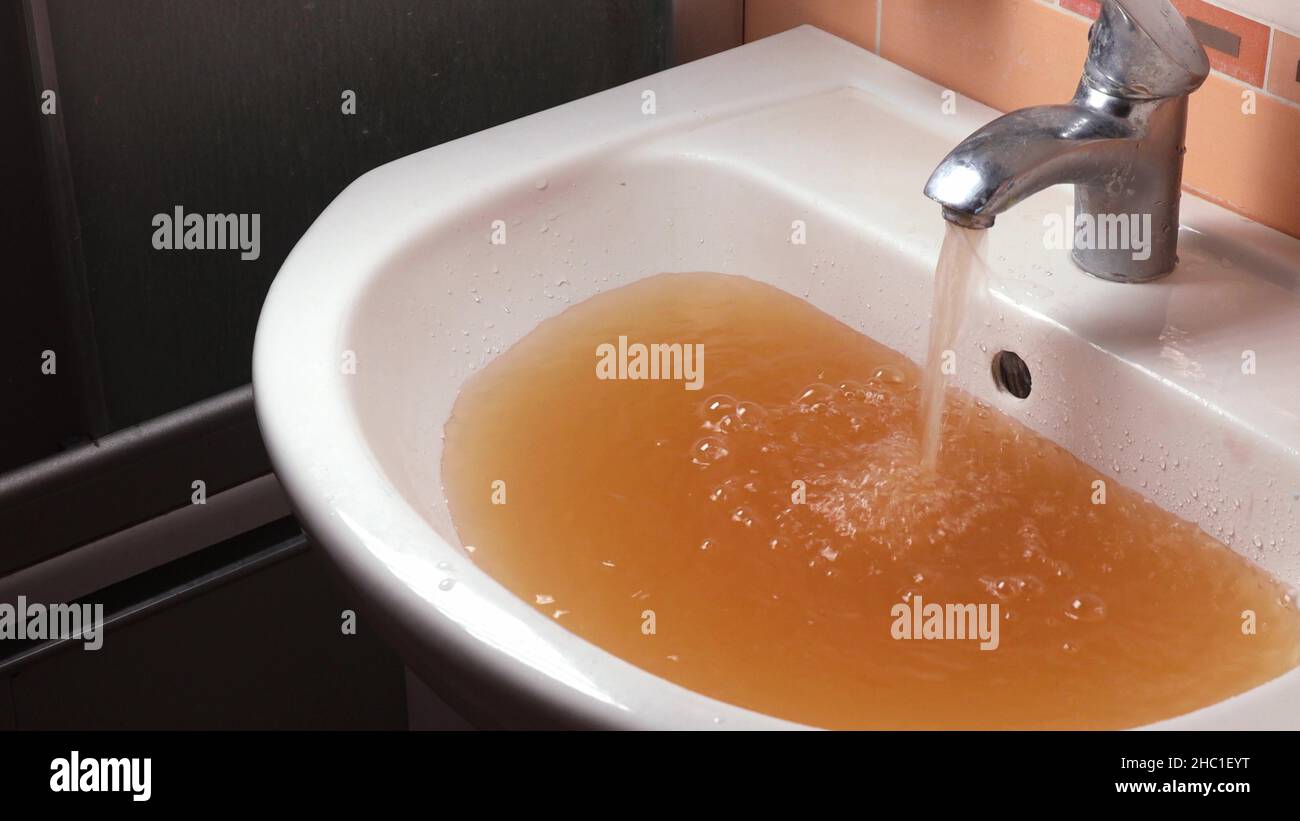 Rusty water pours from tap hi-res stock photography and images - Alamy