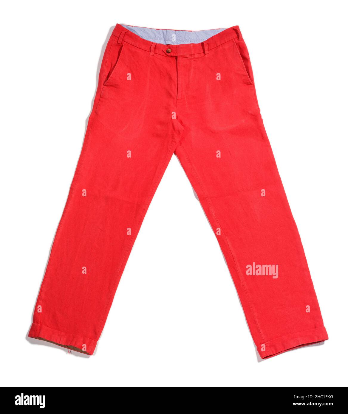 Red trousers. Cut out, flat lay. Mens red pants. Stock Photo