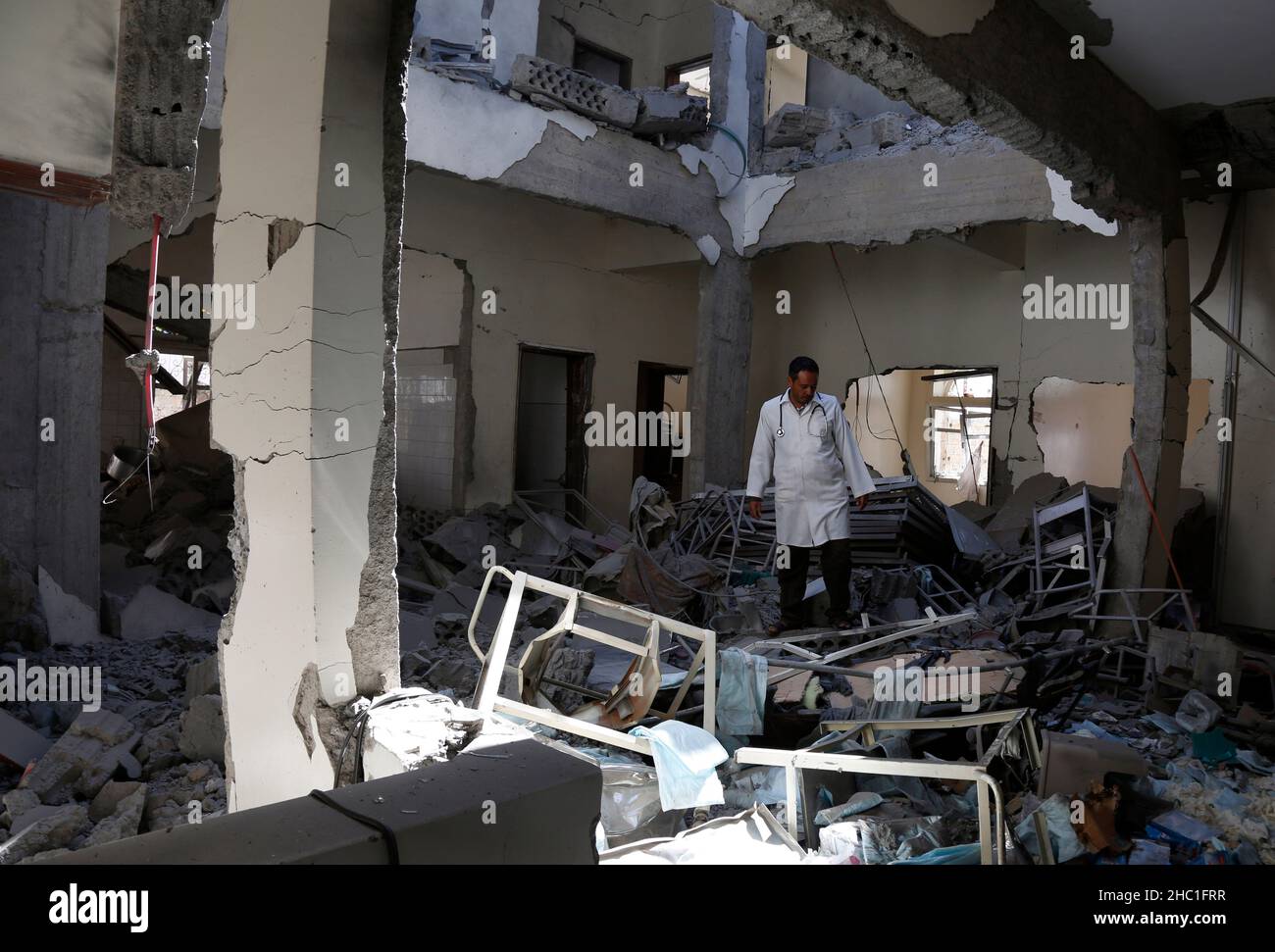 Sanaa. 21st Dec, 2021. A health worker is pictured at a destroyed health center inside the Sanaa International Airport in Yemen on Dec. 21, 2021. The Saudi-led coalition involved in a war in Yemen on Monday launched airstrikes on the Sanaa International Airport held by the Yemeni Houthi rebels, the Saudi Press Agency (SPA) reported. Credit: Mohammed Mohammed/Xinhua/Alamy Live News Stock Photo