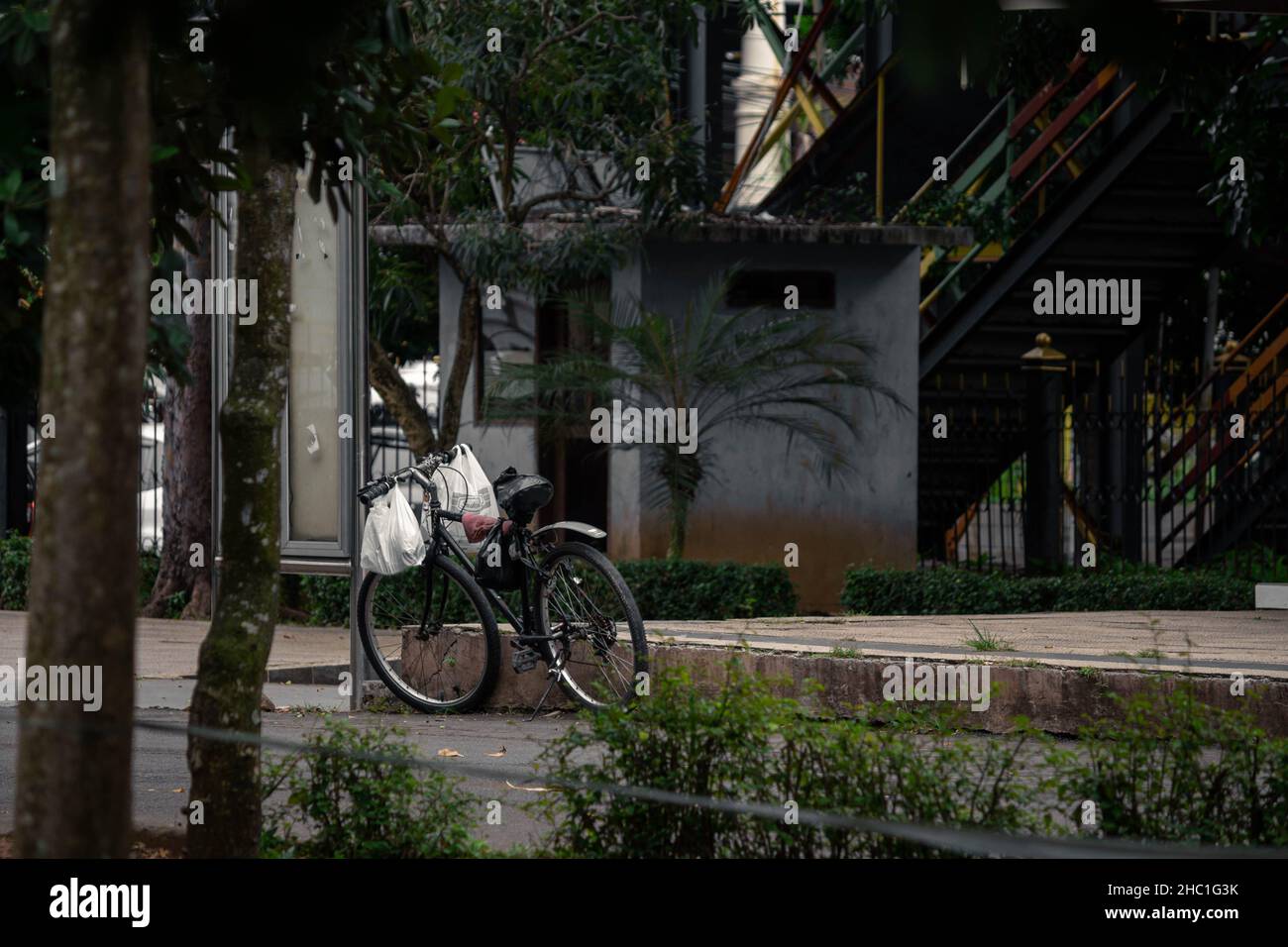 bicycles are parked in the town square of Serang Stock Photo