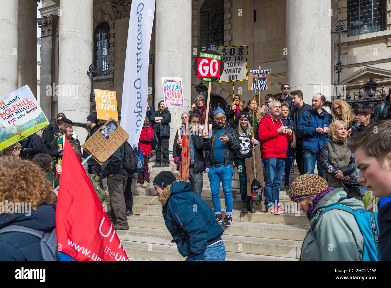 Protesters gathered on the steps of St. Martin in the Fields church, Trafalgar Square, London, England, UK Stock Photo