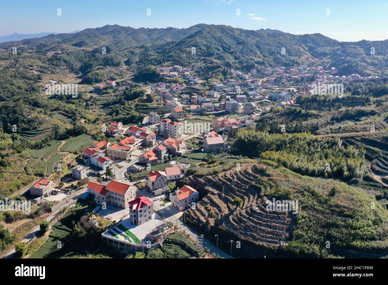 (211221) -- XIAMEN, Dec. 21, 2021 (Xinhua) -- Aerial photo taken on Dec. 7, 2021 shows the scenery of Junying Village of Tongan District in Xiamen, southeast China's Fujian Province. This year marks the 40th anniversary of the establishment of the Xiamen Special Economic Zone (SEZ). The Xiamen SEZ has made important contributions to the country's reform, opening up, and socialist modernization, and played a unique role in promoting national reunification. (Xinhua/Jiang Kehong) Stock Photo