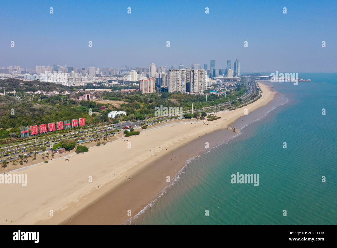 (211221) -- XIAMEN, Dec. 21, 2021 (Xinhua) -- Aerial photo taken on Dec. 12, 2021 shows the coastal view of Xiamen, southeast China's Fujian Province. This year marks the 40th anniversary of the establishment of the Xiamen Special Economic Zone (SEZ). The Xiamen SEZ has made important contributions to the country's reform, opening up, and socialist modernization, and played a unique role in promoting national reunification. (Xinhua/Jiang Kehong) Stock Photo