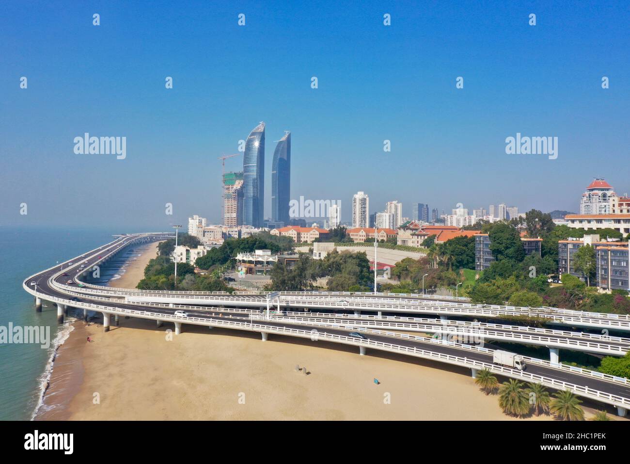 (211221) -- XIAMEN, Dec. 21, 2021 (Xinhua) -- Aerial photo taken on Dec. 12, 2021 shows the city view of Xiamen, southeast China's Fujian Province. This year marks the 40th anniversary of the establishment of the Xiamen Special Economic Zone (SEZ). The Xiamen SEZ has made important contributions to the country's reform, opening up, and socialist modernization, and played a unique role in promoting national reunification. (Xinhua/Jiang Kehong) Stock Photo