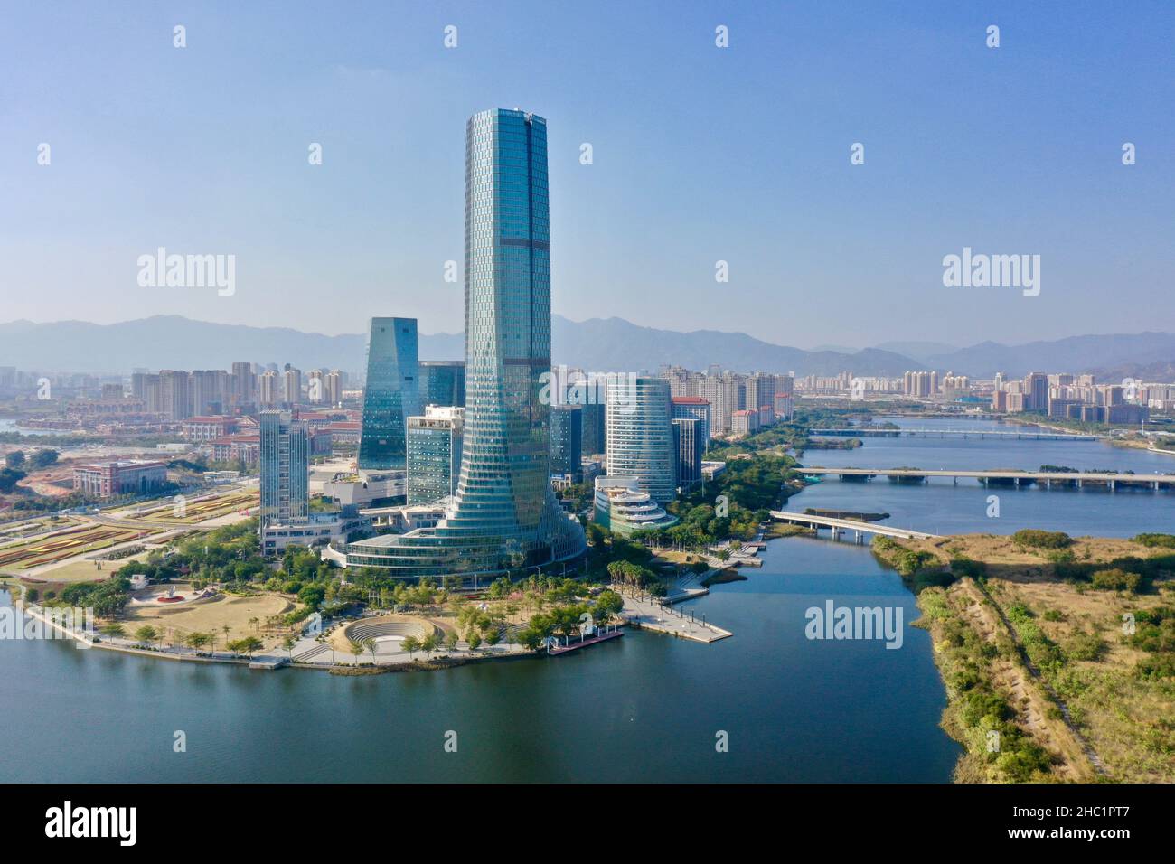 (211221) -- XIAMEN, Dec. 21, 2021 (Xinhua) -- Aerial photo taken on Dec. 8, 2021 shows the city view of Xiamen, southeast China's Fujian Province. This year marks the 40th anniversary of the establishment of the Xiamen Special Economic Zone (SEZ). The Xiamen SEZ has made important contributions to the country's reform, opening up, and socialist modernization, and played a unique role in promoting national reunification. (Xinhua/Jiang Kehong) Stock Photo
