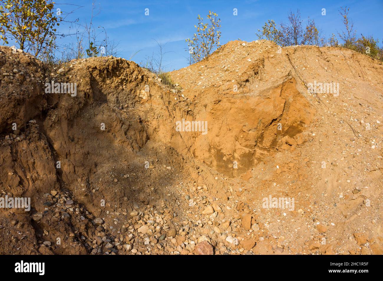 View of dumps on a sand and gravel pit. Extraction of building materials Stock Photo