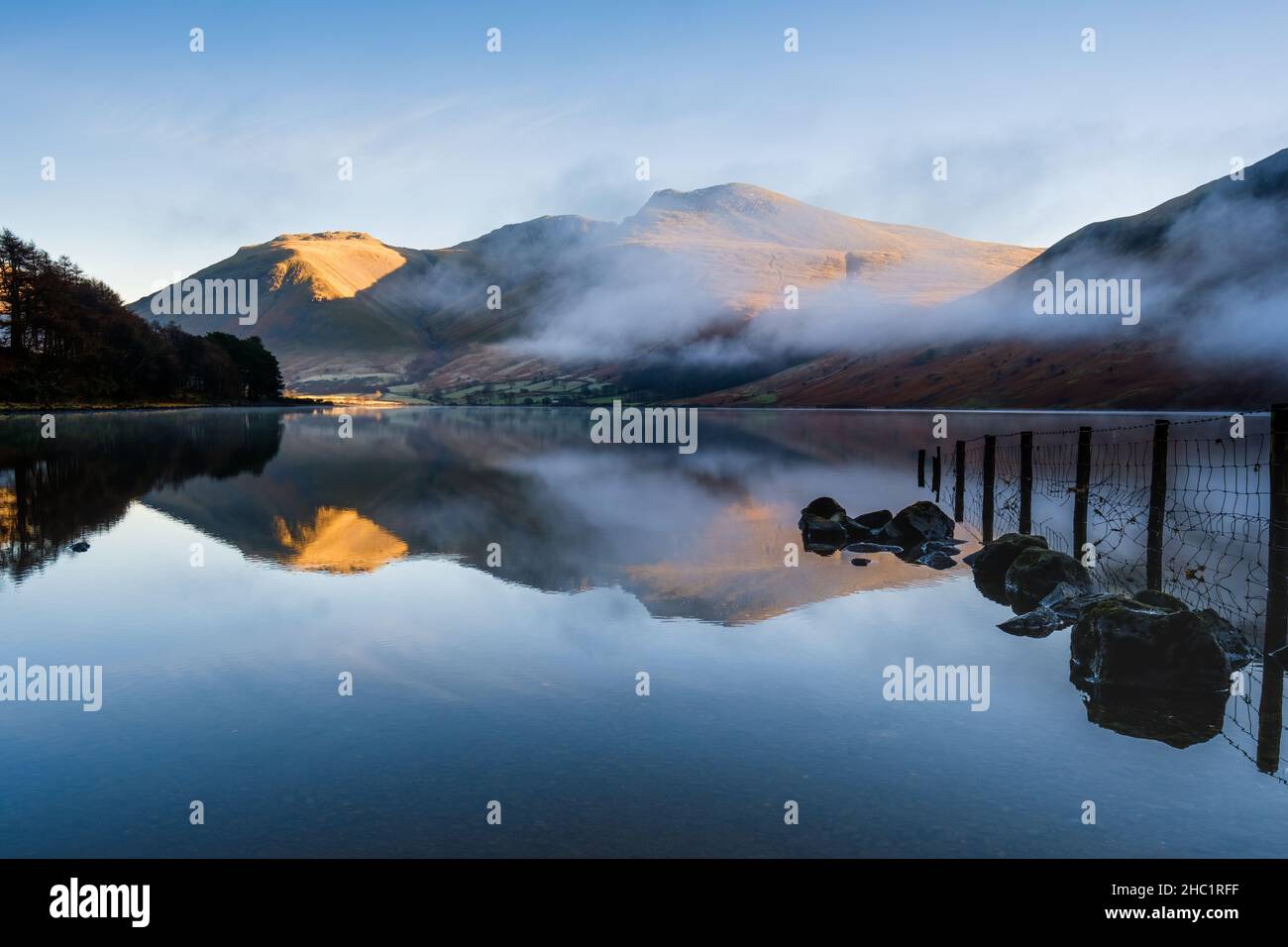 Wastwater & the Scafell Range on a calm & cool misty morning in the Lake District, UK Stock Photo