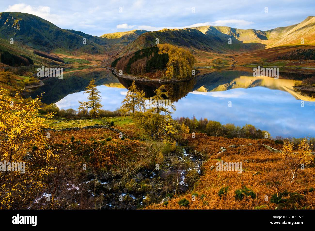 Haweswater in the Lake District, UK, in early November, the morning sunlight catching the tops of the High Street range. Stock Photo
