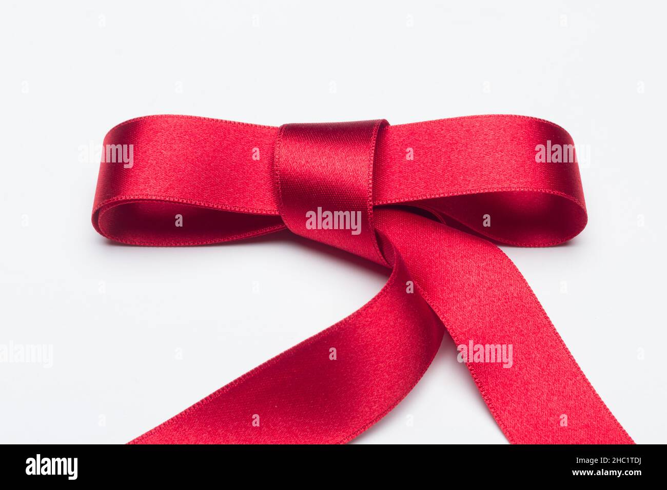 Red ribbon for gift wrapping on a white background Stock Photo Alamy