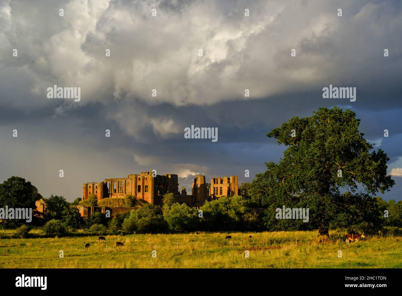 A retreating storm over Kenilworth Castle in Warwickshire, UK, taken shortly before sunset. Stock Photo