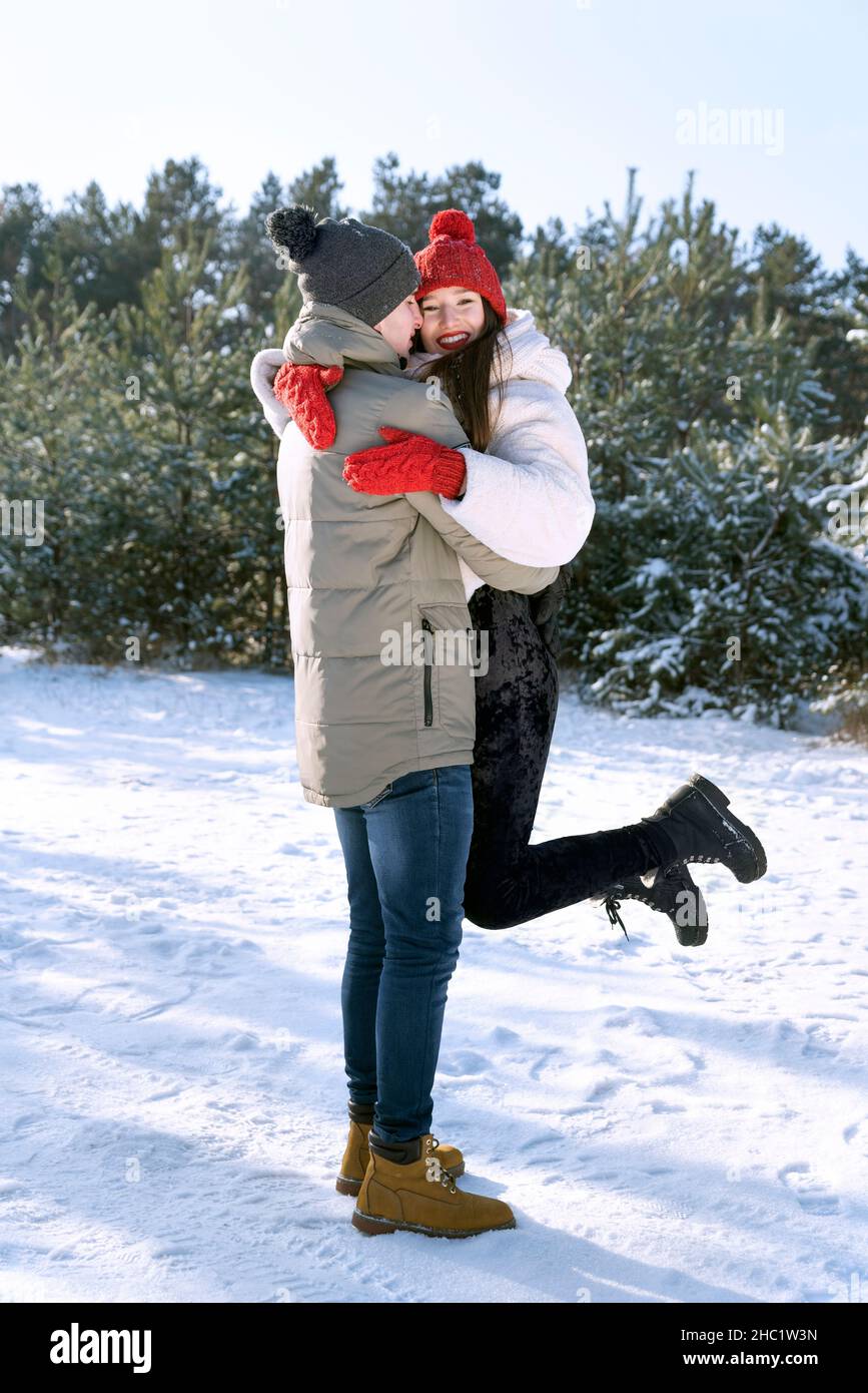Couple hugs in winter forest hi-res stock photography and images - Alamy
