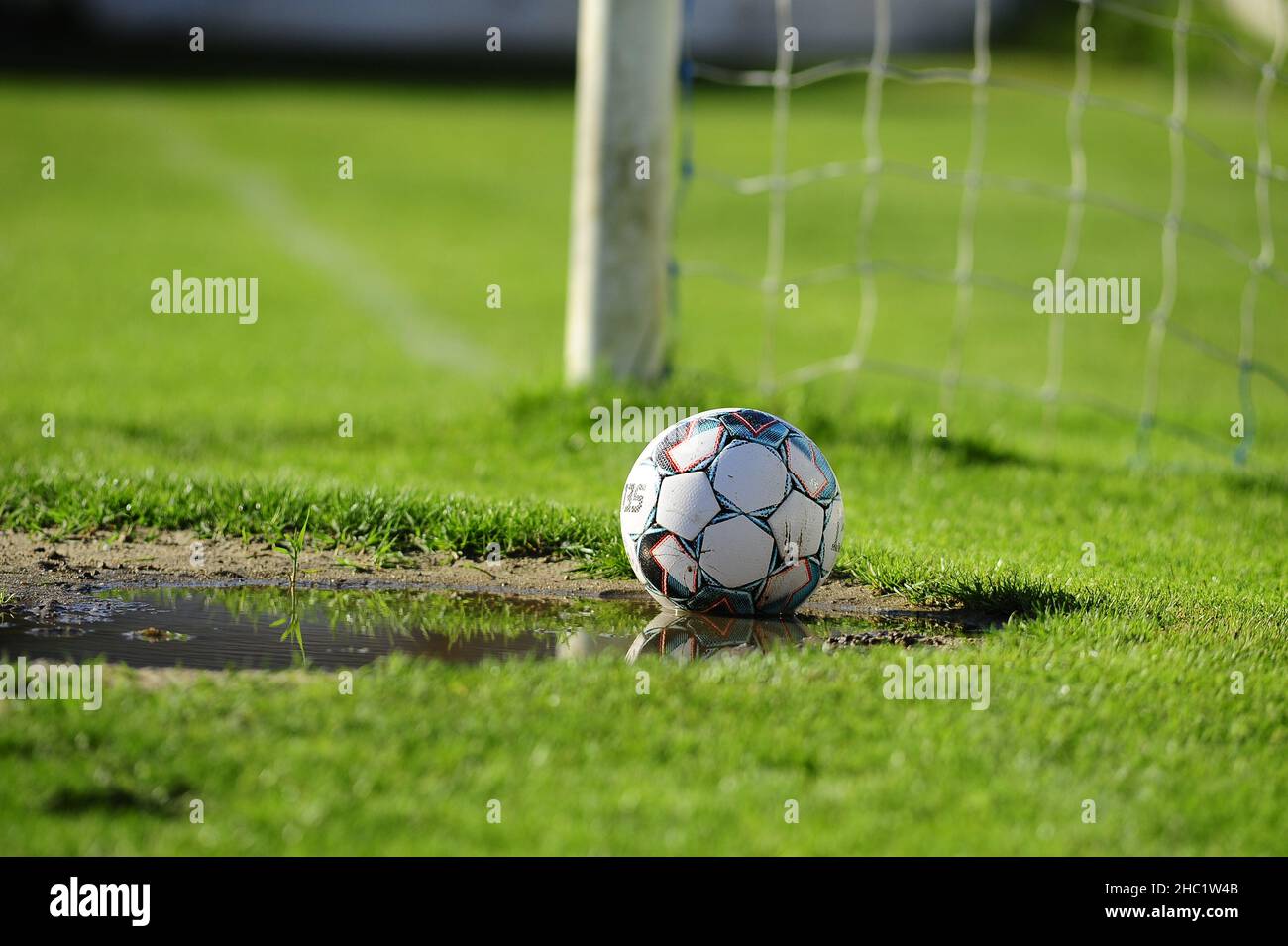 Football Ball in muddy pitch Stock Photo Alamy